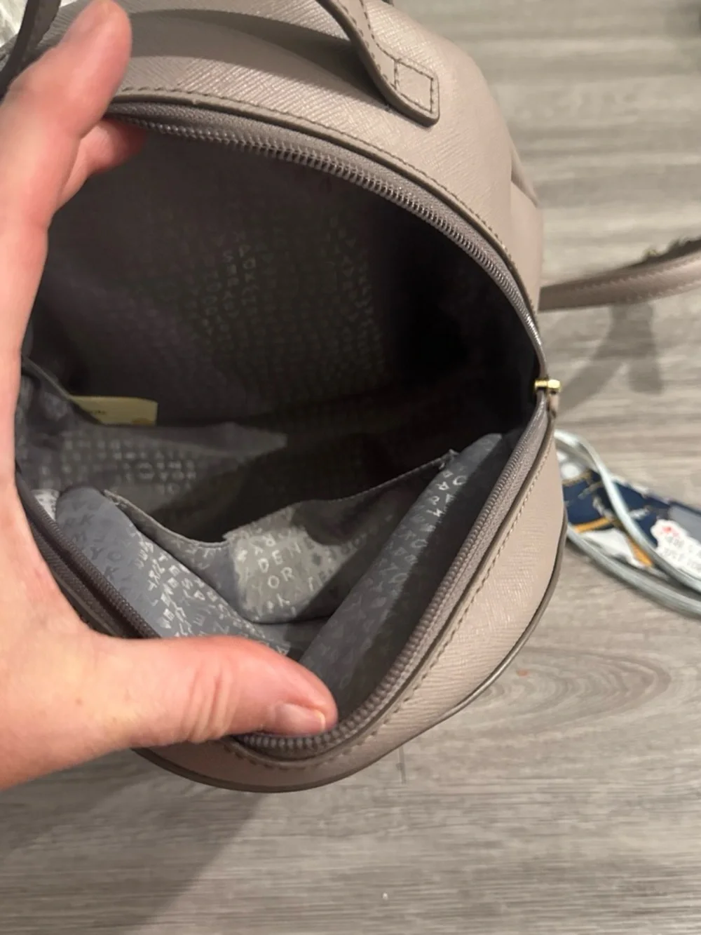 Kate Spade taupe backpack with gold glitter trim